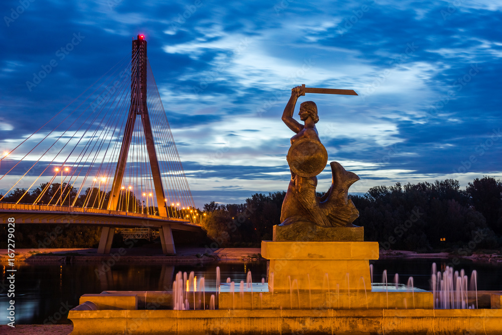Historic Mermaid near bridge Swietokrzyski over the Vistula river in Warsaw, Poland