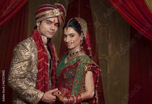 Portrait of beautiful couple holding hands  © IndiaPix