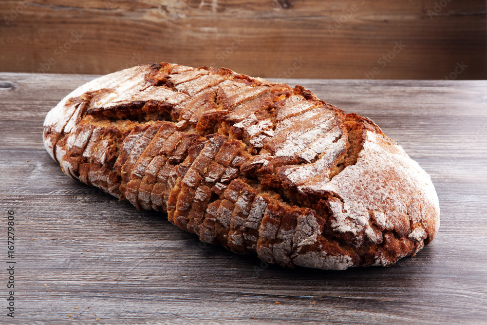 freshly baked bread on wooden board. cutted bread freshly baked bread on wooden board. cutted bread