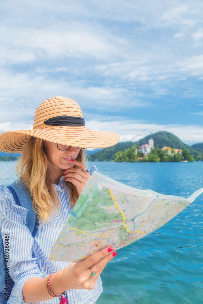 Fototapeta premium Tourist with a map enjoying the summertime.