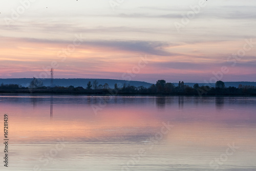 Field, river and beautiful sky and clouds reflected © ileana_bt