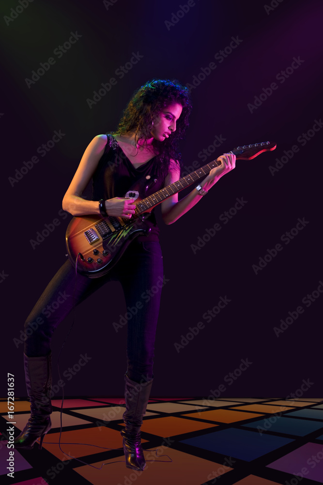 Young woman playing the guitar Young woman playing the guitar