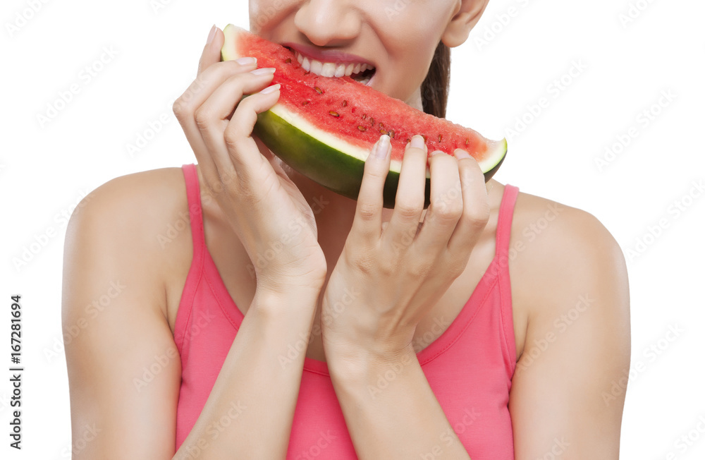 Midsection of a young woman biting watermelon over white background Midsection of a young woman biting watermelon over white background
