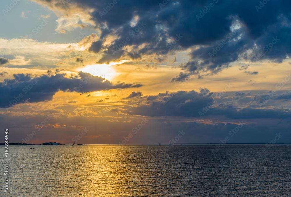 HDR image of Sunset over the Baltic Sea with big clouds