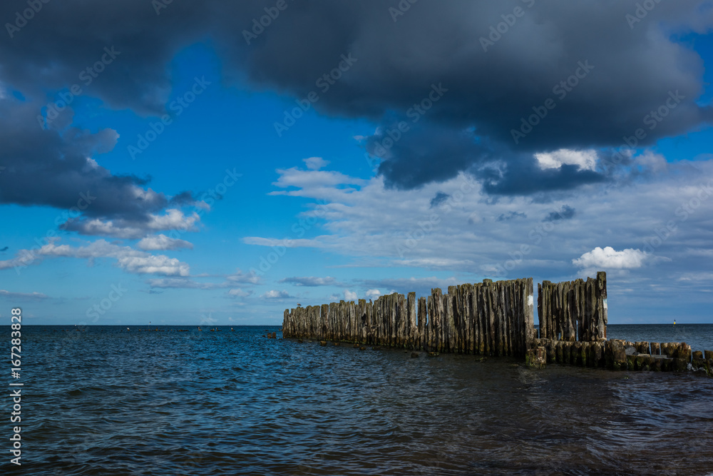 Wooden breakwaters line at Baltic Sea in Babie Doly, Gdynia, Poland