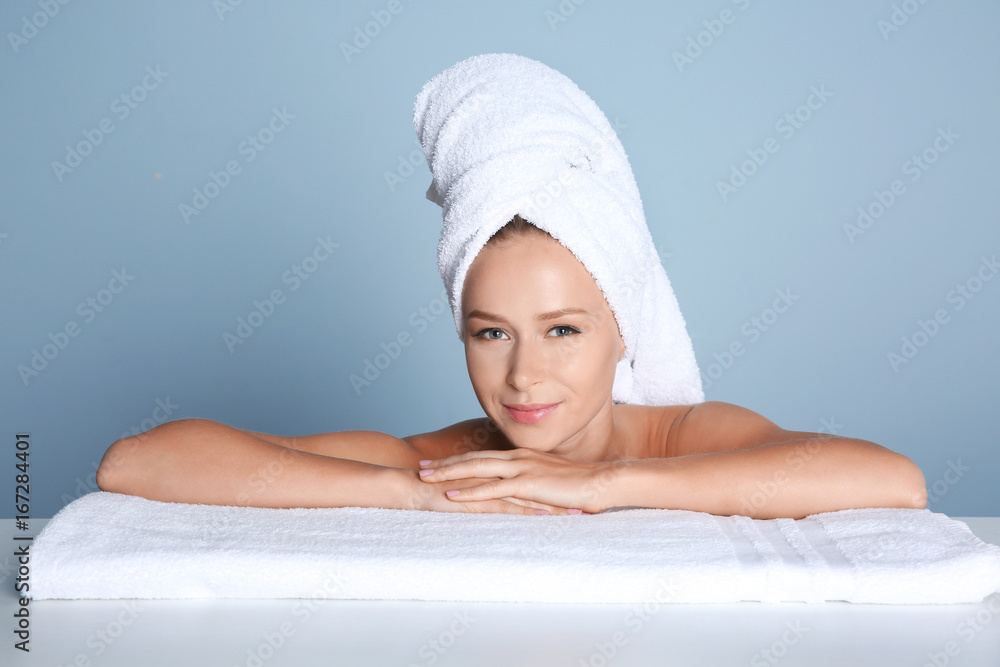Beautiful young woman after bath on light background Beautiful young woman after bath on light background
