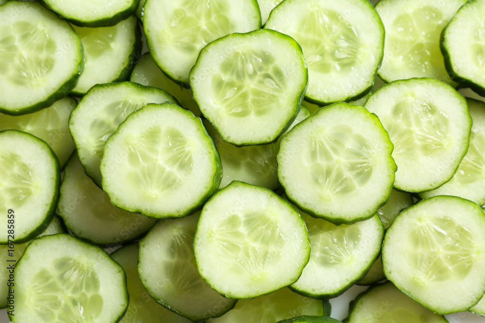 Fresh cucumber slices as background