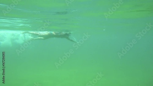 Wallpaper Mural Young Spanish girl swimming freestyle style in the transparent water in Costa Brava in Spain Torontodigital.ca