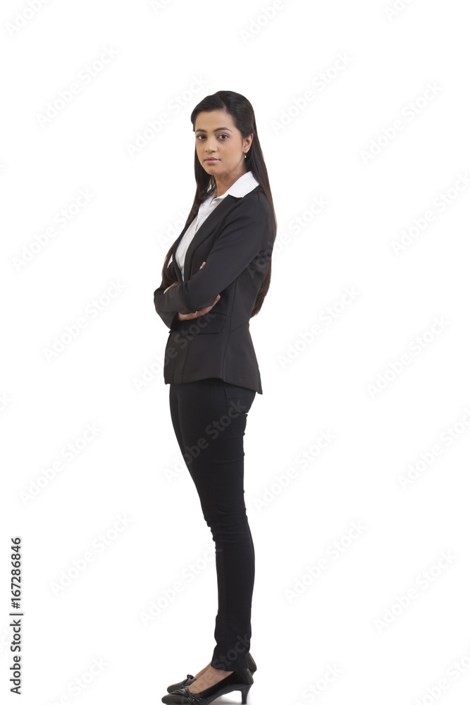 Side view of confident businesswoman with arms crossed isolated over white background Side view of confident businesswoman with arms crossed isolated over white background