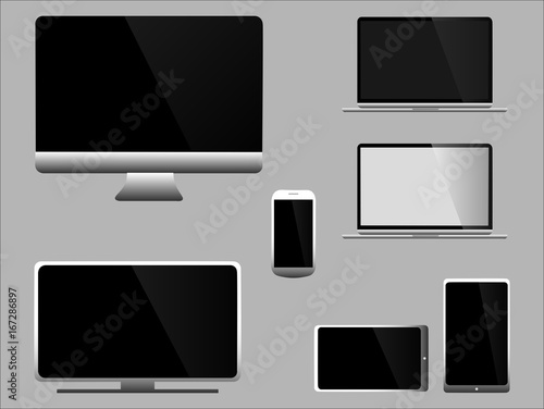 Ensemble de moniteurs gris et blanc modernes, ordinateur, ordinateur portable, tablette, téléphone et télévision