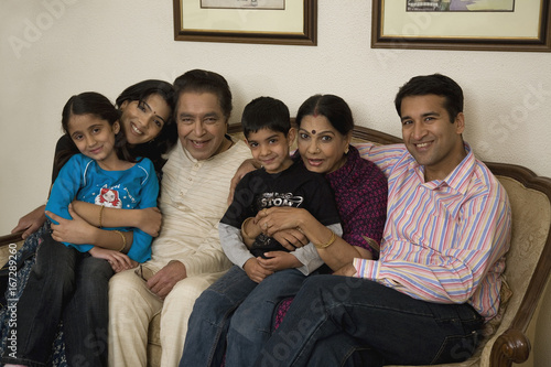 Family sitting together on a couch  photo