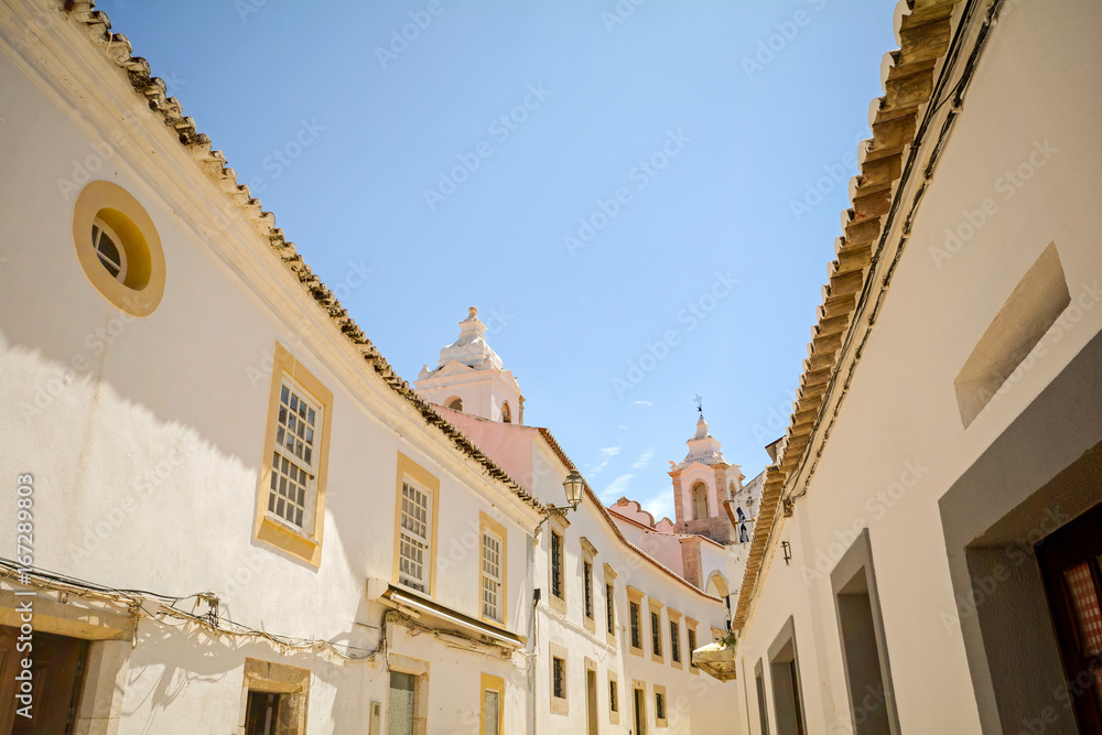 Street with historical buildings in the old town of Lagos, Algarve Portugal