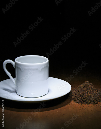 Fototapeta Naklejka Na Ścianę i Meble -  cofee cup of cofee and cofee grain in the shadow