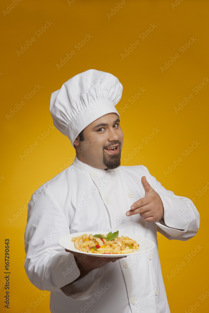 Portrait of chef with plate of pasta Portrait of chef with plate of pasta