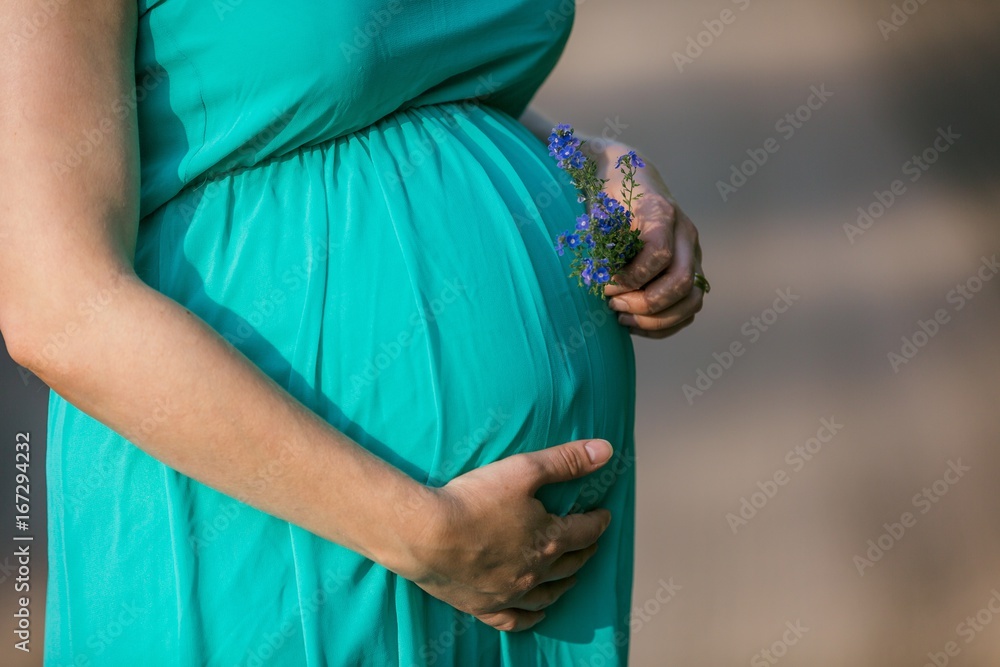 Pregnant woman outdoor portrait