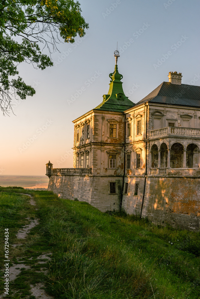 Medieval Pidhirtsi Castle in sunset summer light, Pidhirtsi village, Lviv region, Ukraine