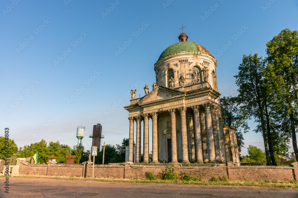 Baroque Roman Catholic church of St. Joseph in Pidhirtsi. Pidhirtsi village is located in Lviv province, Western Ukraine. Summer sunset light.