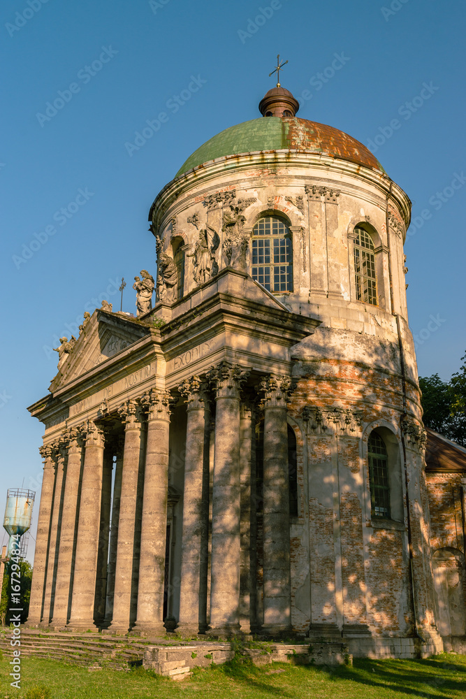 Baroque Roman Catholic church of St. Joseph in Pidhirtsi. Pidhirtsi village is located in Lviv province, Western Ukraine. Summer sunset light. Baroque Roman Catholic church of St. Joseph in Pidhirtsi. Pidhirtsi village is located in Lviv province, Western Ukraine. Summer sunset light.