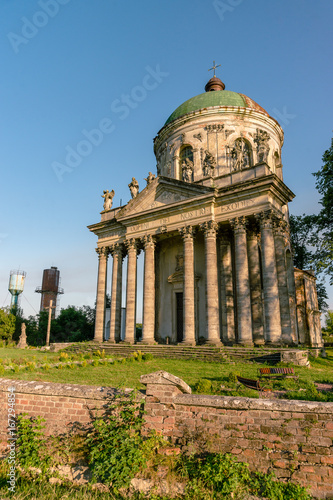 Baroque Roman Catholic church of St. Joseph in Pidhirtsi. Pidhirtsi village is located in Lviv province, Western Ukraine. Summer sunset light. photo