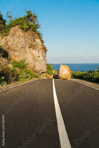 New asphalt road path blocked by land slide / rock fall.