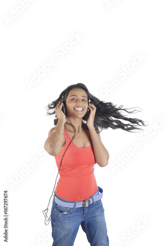 Portrait of a woman with headphones enjoying