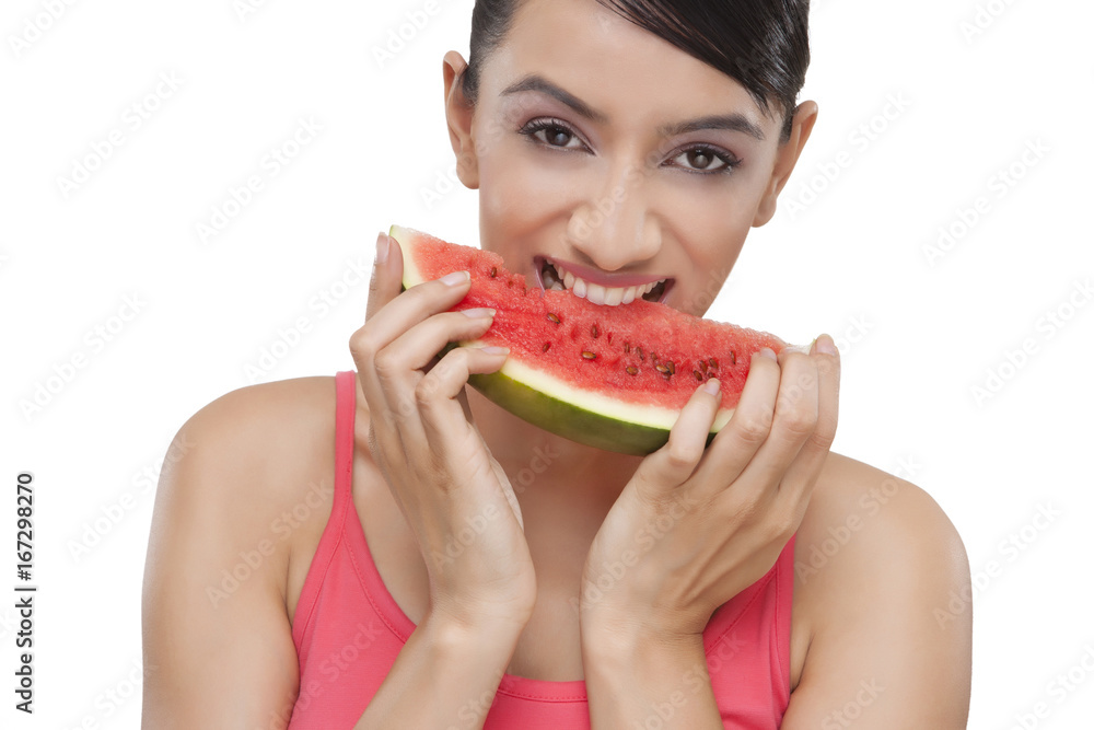 Close-up portrait of smiling young woman with a slice of watermelon over white background Close-up portrait of smiling young woman with a slice of watermelon over white background