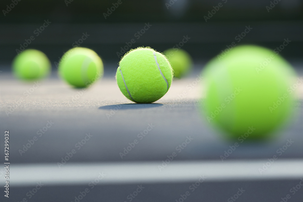 Close-up of tennis balls lying on ground 
