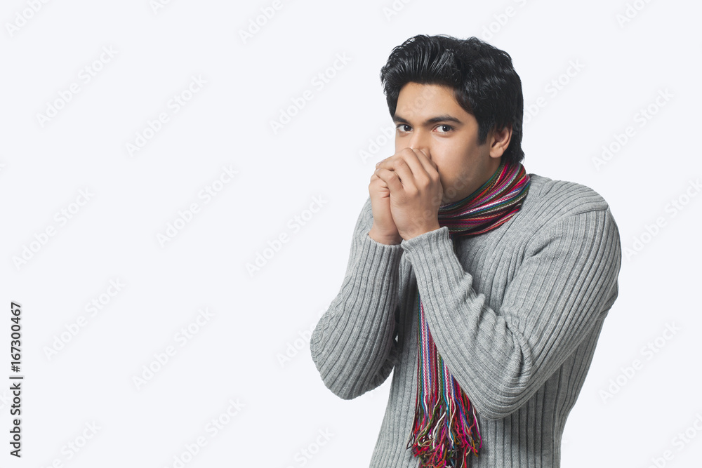 Portrait of young man feeling cold Portrait of young man feeling cold