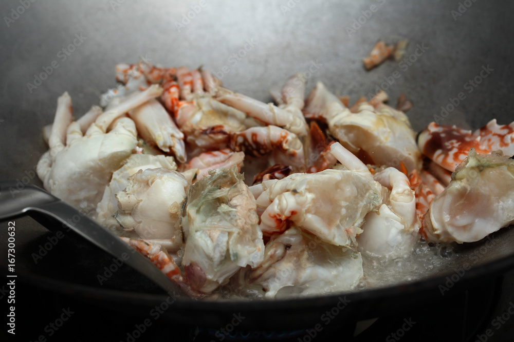 Cooking, Stir-fried crab in curry powder is top-ten of popular Thai food. Cooking, Stir-fried crab in curry powder is top-ten of popular Thai food.