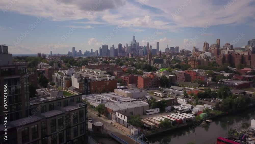 day descending view of Manhattan skyline revealing iconic rooftop water tank in Brooklyn day descending view of Manhattan skyline revealing iconic rooftop water tank in Brooklyn