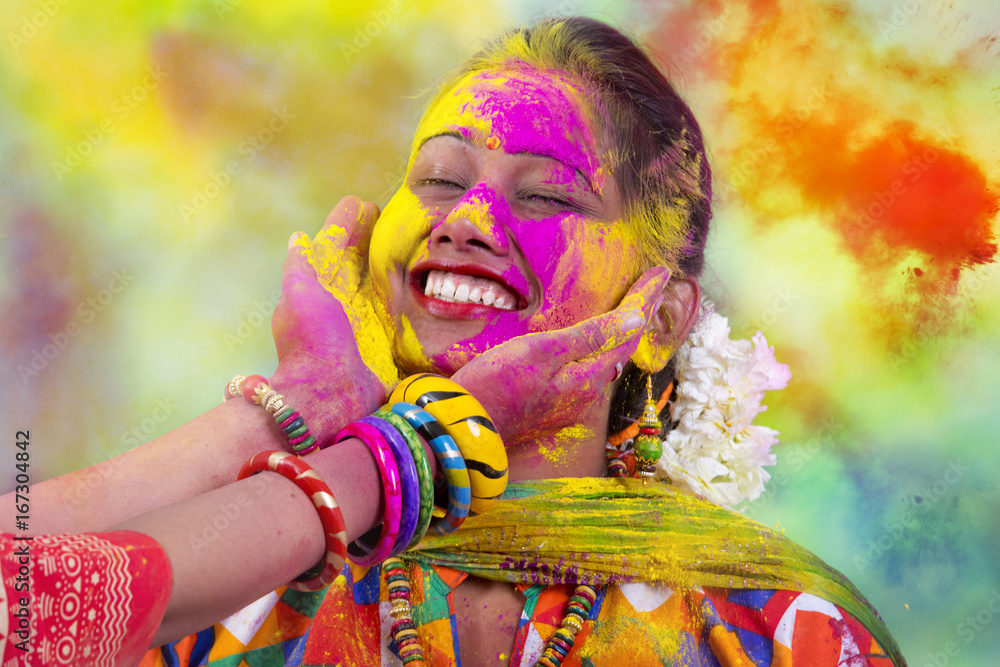 Fotografie, Obraz Portrait of young Indian Woman celebrating Holi color  festival | Posters.cz