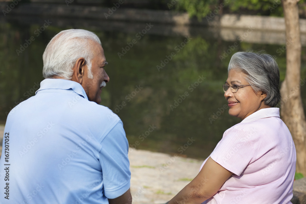 Relaxed couple spending time at park Relaxed couple spending time at park
