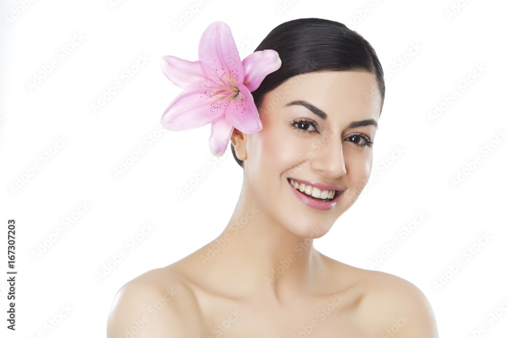 Portrait of a beautiful woman with flower in hair Portrait of a beautiful woman with flower in hair