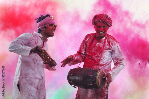 Photography Two Young Indian men With Colored Face Dancing During Holi Color festival