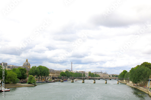 View of Paris along the seine river. © alexmillos