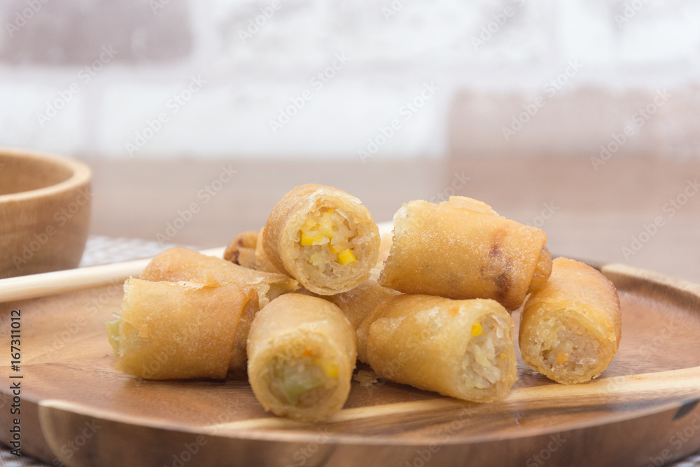 Fried Spring Roll on wooden plate with sauce Fried Spring Roll on wooden plate with sauce