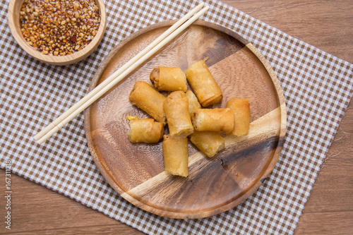 Fried Spring Roll on wooden plate with sauce