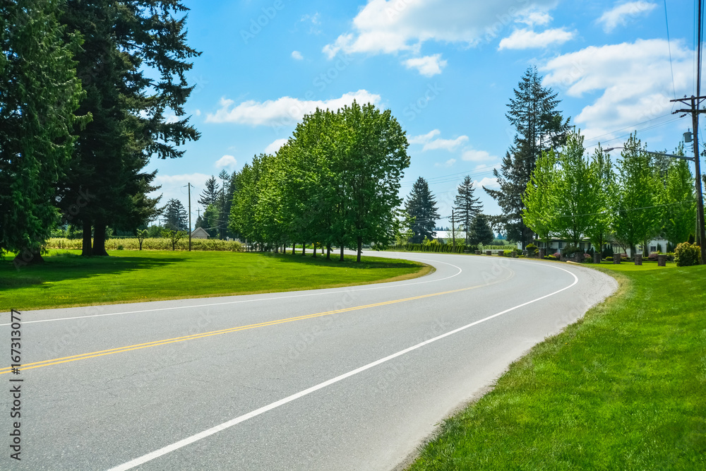Turn of asphalt road in rural area of Fraser Valley in British Columbia Turn of asphalt road in rural area of Fraser Valley in British Columbia