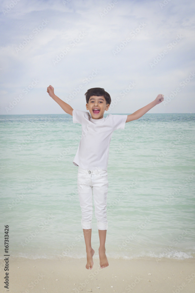 Portrait of boy jumping in the air