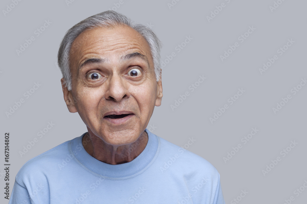 Portrait of surprised senior man raising eyebrows Portrait of surprised senior man raising eyebrows