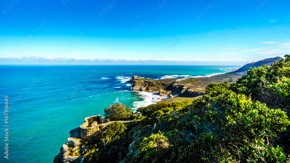 Rugged coastline and steep cliffs of Cape of Good Hope on the Atlantic Ocean side of the Cape Peninsula in South Africa Rugged coastline and steep cliffs of Cape of Good Hope on the Atlantic Ocean side of the Cape Peninsula in South Africa
