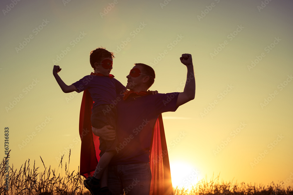© altanaka - Father and son playing superhero at the sunset time. © altanaka - Father and son playing superhero at the sunset time.