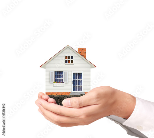 Mortgage concept by house in hand