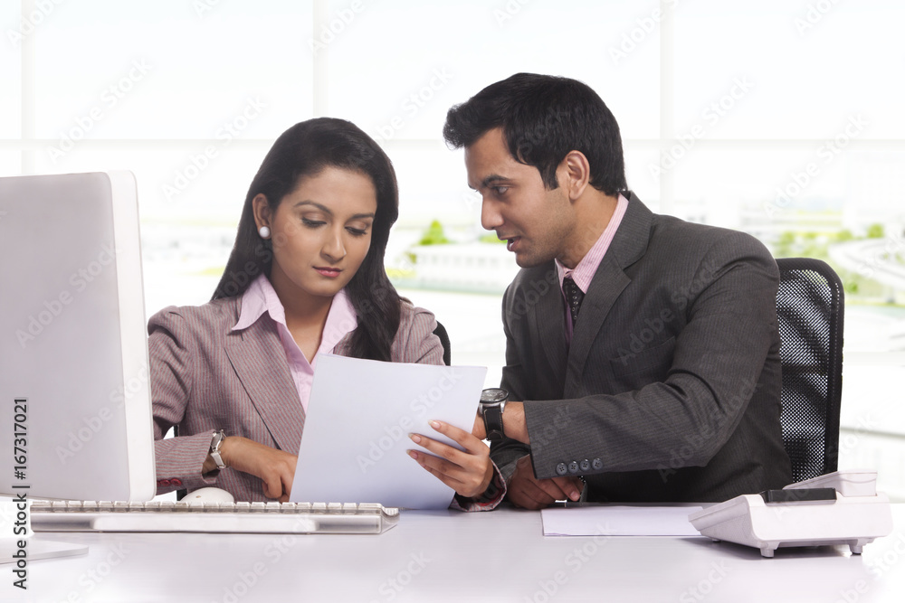 Businessman and businesswoman working together Businessman and businesswoman working together