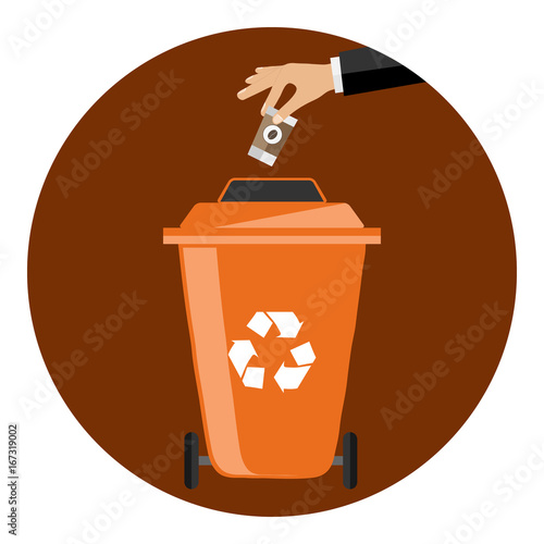 The hand throws the garbage into the container