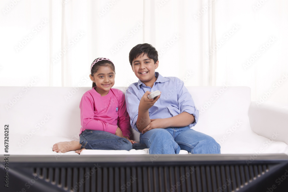 Brother and sister watching tv Brother and sister watching tv