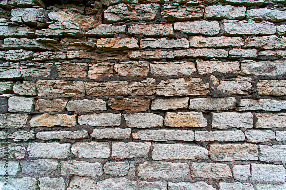Fototapeta premium Background of an old limestone wall