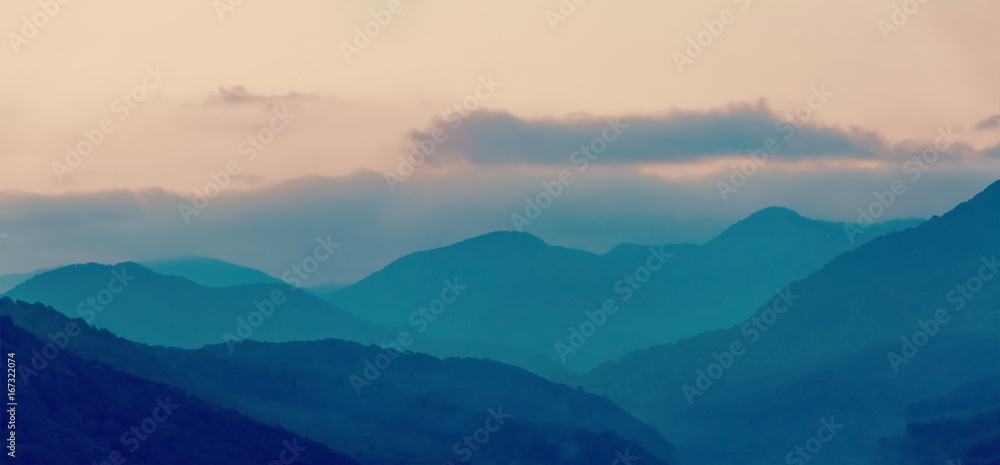 Foggy mountains, beautiful landscape, abstract blurred background Foggy mountains, beautiful landscape, abstract blurred background