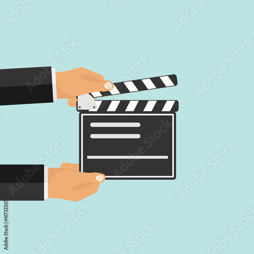Production of the film. Hands hold the production of the film