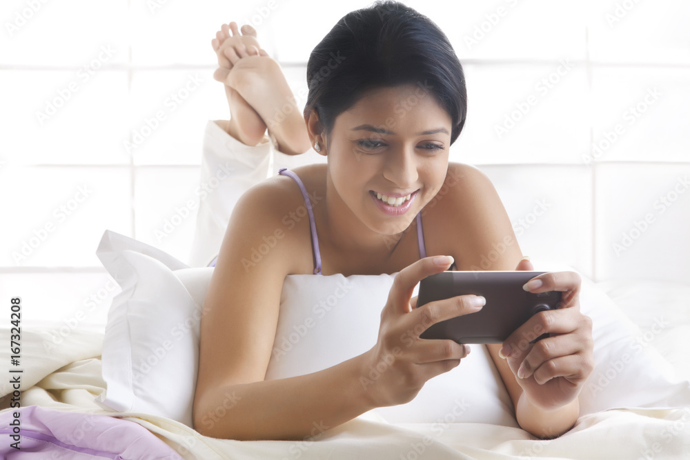 Girl looking at picture on mobile phone Girl looking at picture on mobile phone